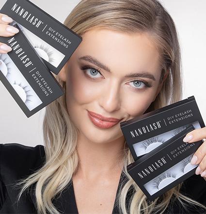 Blonde woman holding diy eyelash extension kits