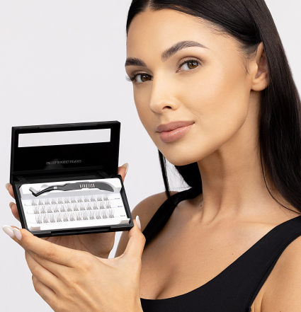 A woman holding a Nanolash Stick & Go cassette